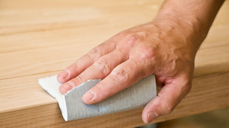 Man sanding wood