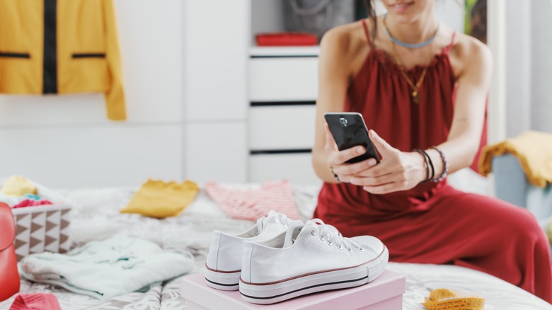 Person taking photos of items to sell