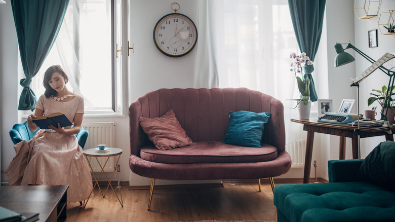 Woman reading in cozy room