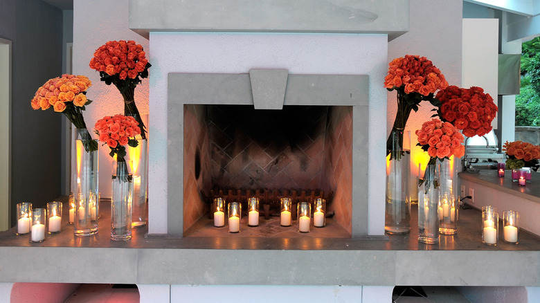 Candles in and surrounding fireplace