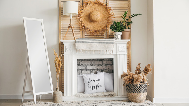 White pillows in white fireplace