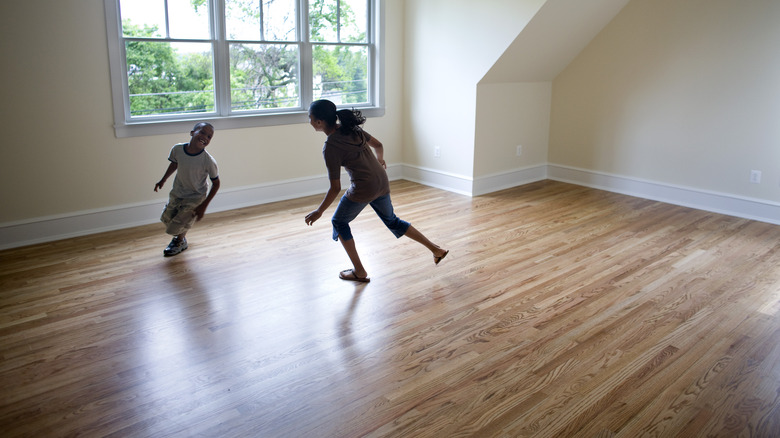 family playing on wood floors