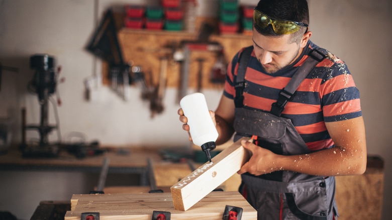 applying glue to wood