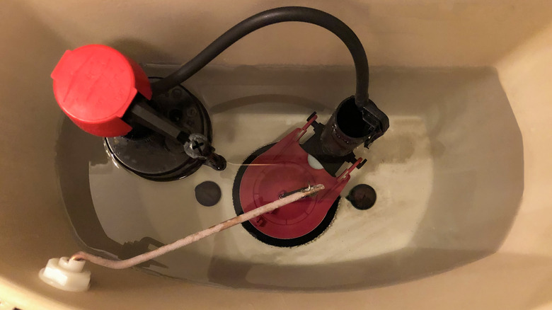 Plumbing parts inside toilet tank