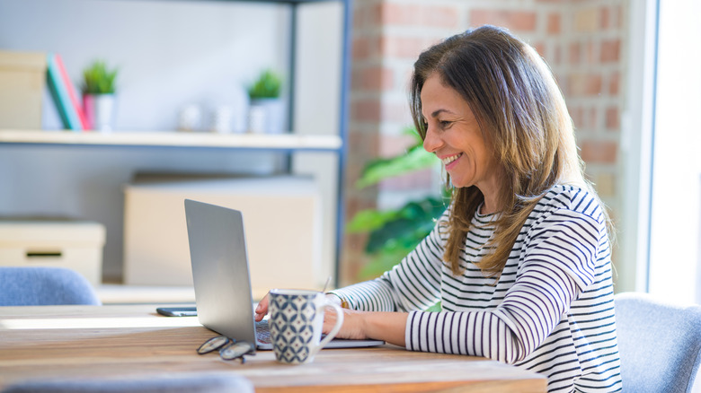 Smiling woman typing