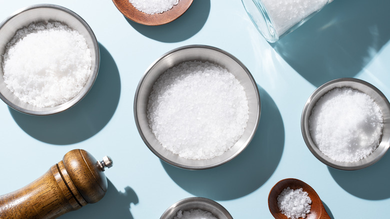 Salt in bowls are placed on a table