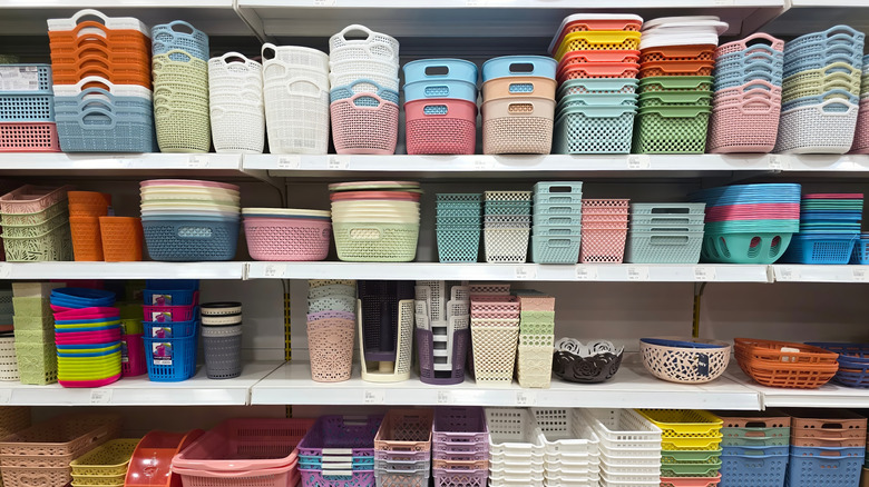 A variety of colorful storage bins on a store shelf