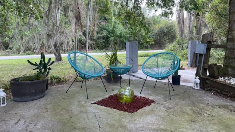 Teal outdoor chairs on patio