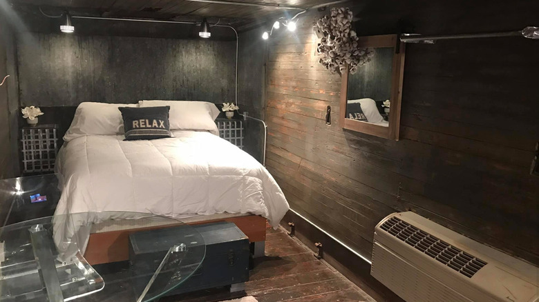 Queen bed inside Boxcar Bunkhouse