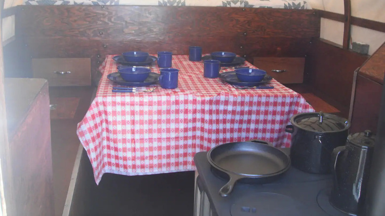 Table and stove inside wagon