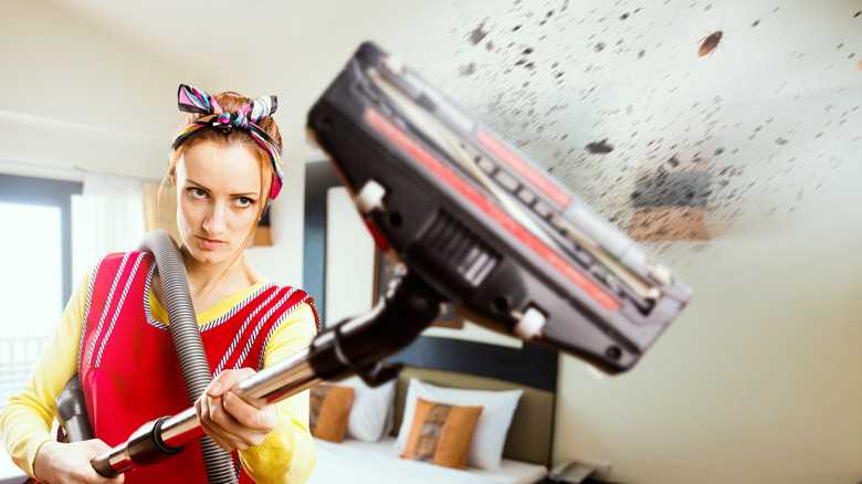 Woman vacuuming her home