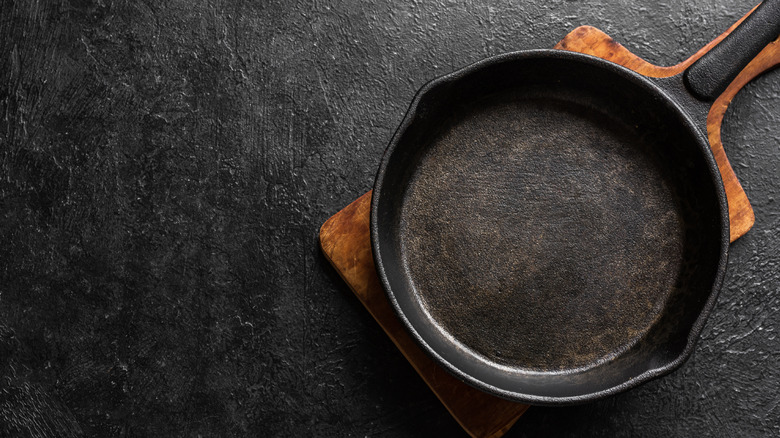 cast iron pan on black background