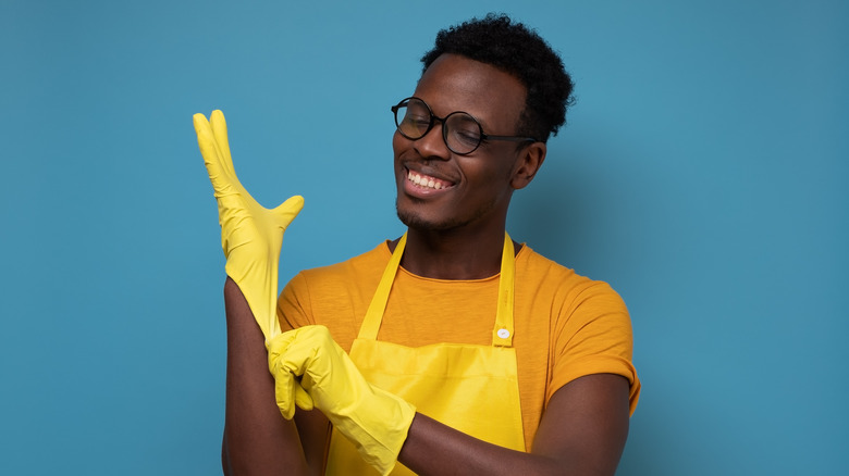 Man wearing protective gloves