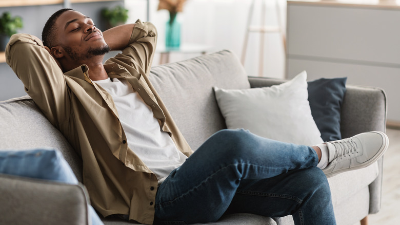 Man relaxing on couch