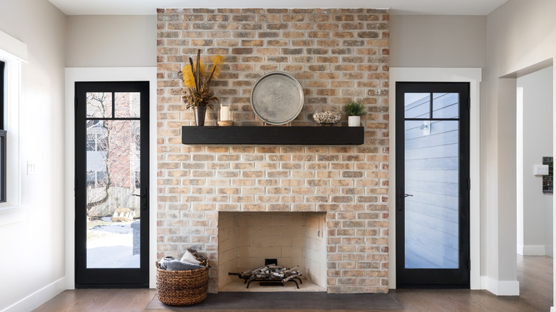 floating wood mantel over fireplace