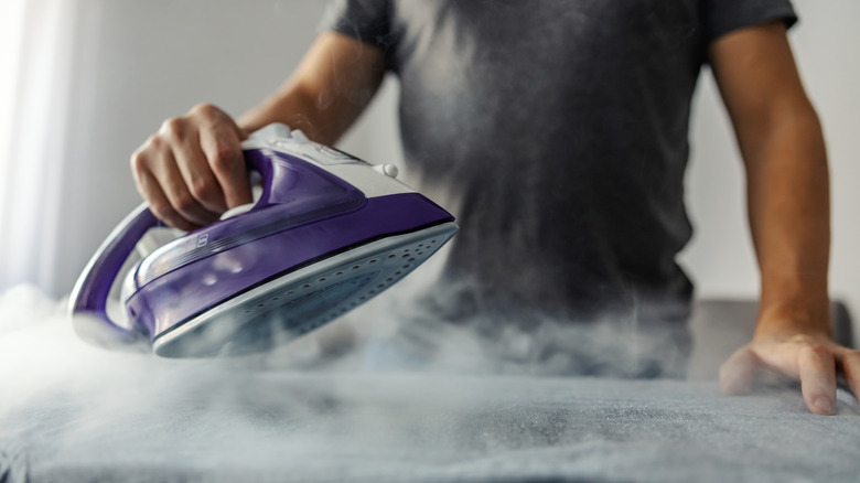 Person ironing clothes