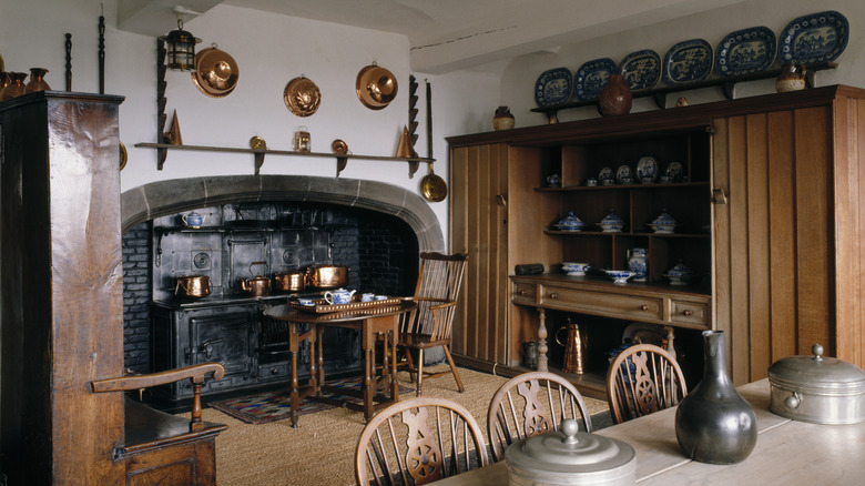 Copper pots hang over the hearth stove in the kitchen at Lindisfarne Castle