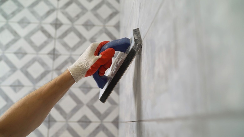 Adding grout to bathroom tiles