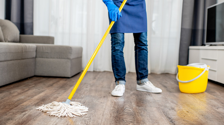 Woman mopping the floor