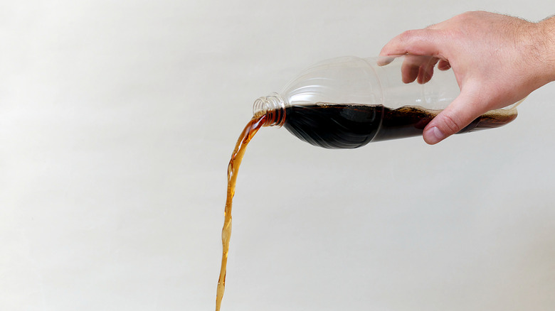 Pouring cola from bottle