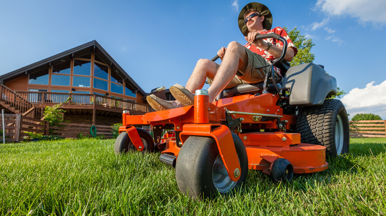 man riding a zero-tern mower