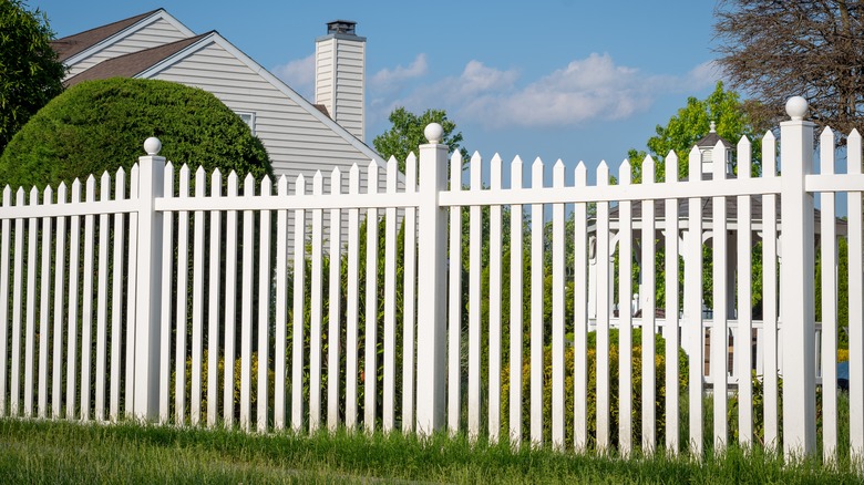 White property fence in yard